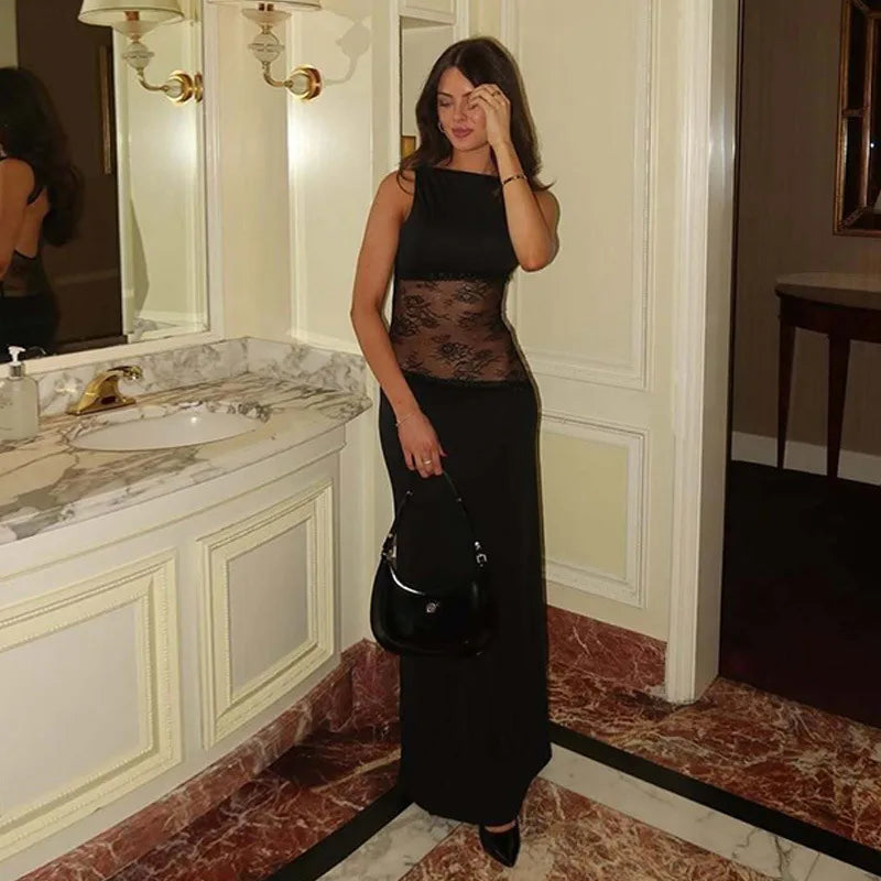 Black lace cut-out gown photographed indoors, highlighting transparent lace waist.